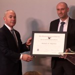 Lori Scialabba, Acting USCIS Director and Adam Hunter, Acting USCIS Chief of Staff present Alejandro N. Mayorkas, Deputy Secretary of Homeland Security, with the Outstanding American by Choice recognition in Washington, DC, Jan. 15, 2014